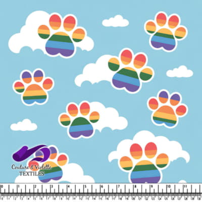 Rainbow striped paw prints among white clouds on a blue sky