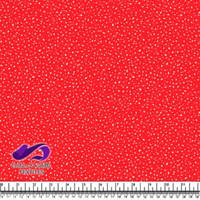 Red fabric with scattered small white leaf pattern