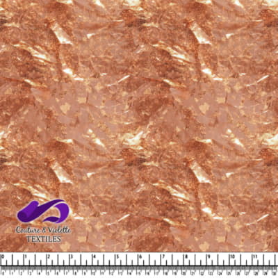 Shiny rose gold foil textured fabric with an irregular organic pattern
