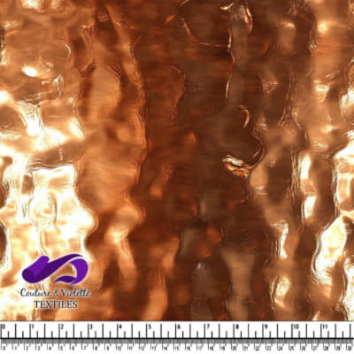 Textured metallic copper fabric with a wavy hammered pattern